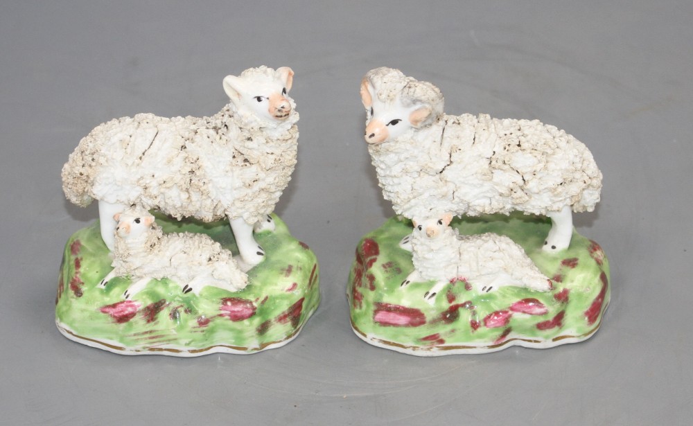 A pair of Staffordshire porcelain groups of sheep and lambs, c.1840-50, L. 7.4cm